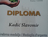 Slavomir Kadic with Olive oil quality award. Click for larger image